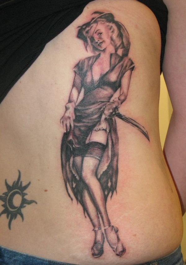 Tribal Sun And Pinup Girl Tattoo On Back