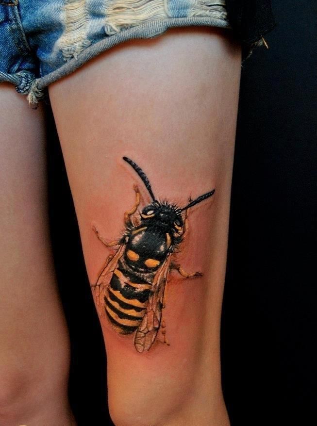 Colored Bee Tattoo On Left Thigh