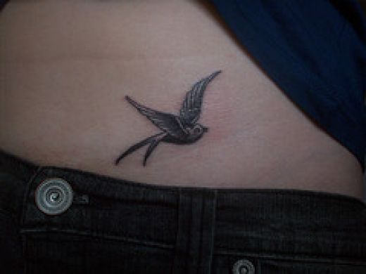 Small Grey Sparrow Tattoo On Hip