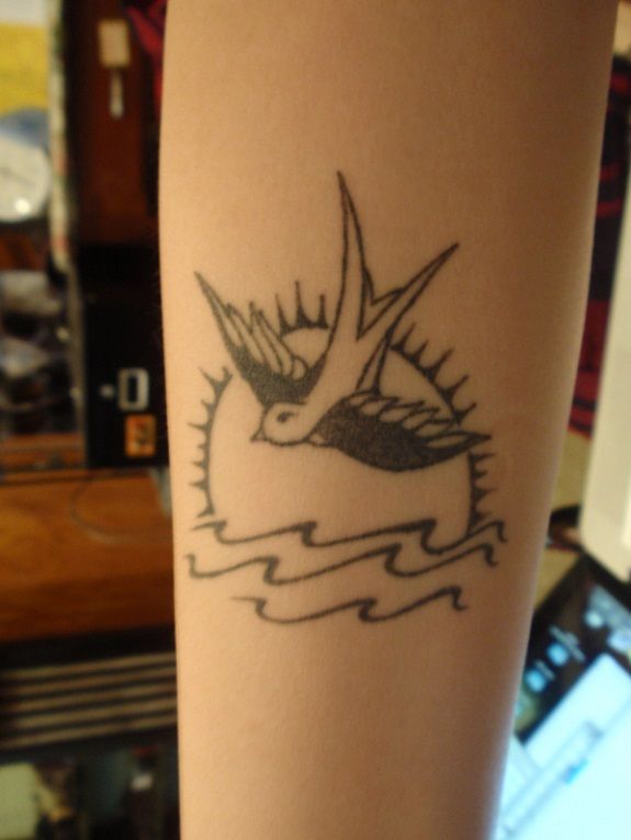 Sun And Flying Sparrow Tattoo On Bicep