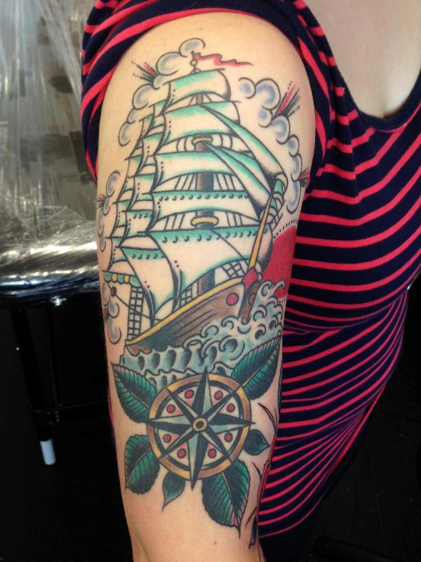 Girl With Ship Tattoo On Right Half Sleeve