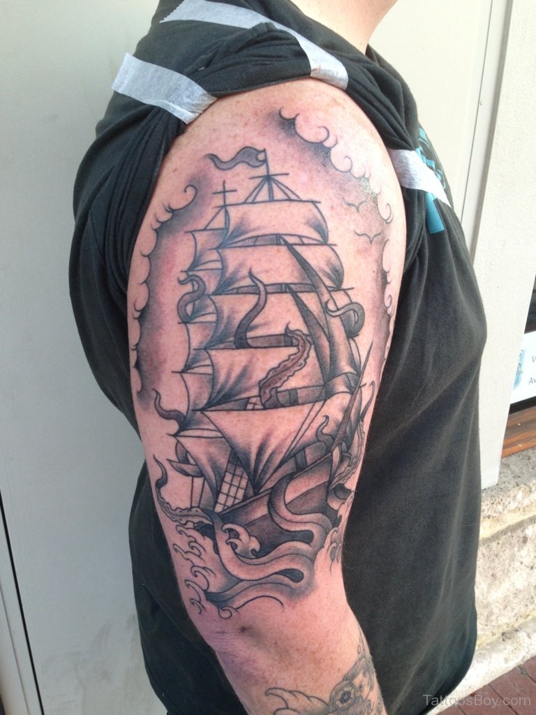 Man With Ship Tattoo On Half Sleeve