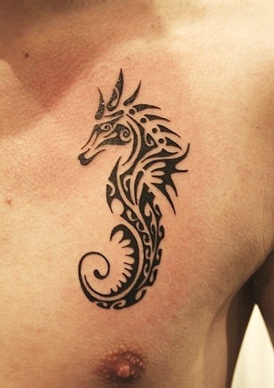 Amazing Tribal Seahorse Tattoo On Man Chest