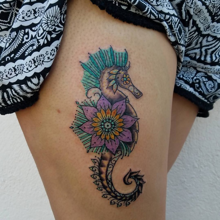 Purple Flower Seahorse Tattoo On Girl Thigh