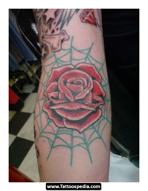 Spider Web And Rose Flower Tattoo On Elbow