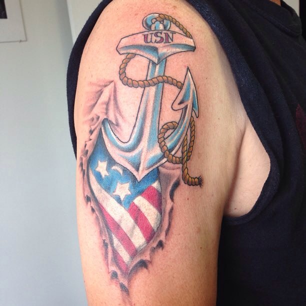 Ripped Skin US Flag And Anchor Tattoo on Shoulder